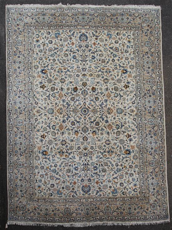 A Tabriz cream ground carpet, 12ft 6in. by 9ft 9in.